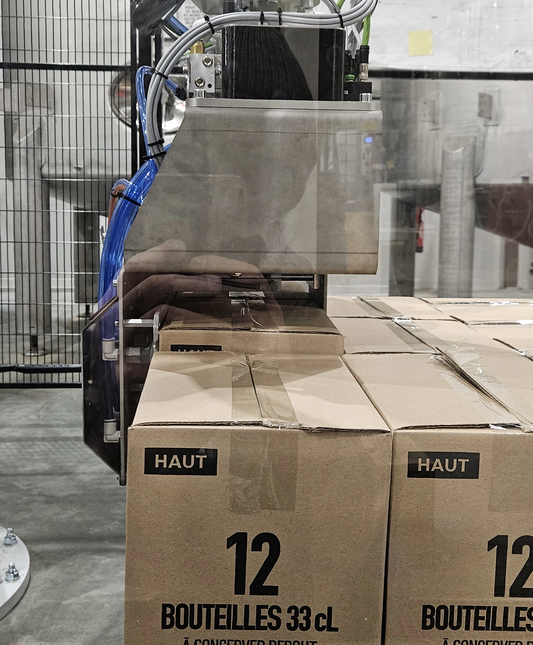 Palettisation de 2 caisses de bière par cycle